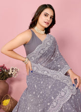 Purple colour party wear saree looking ornate